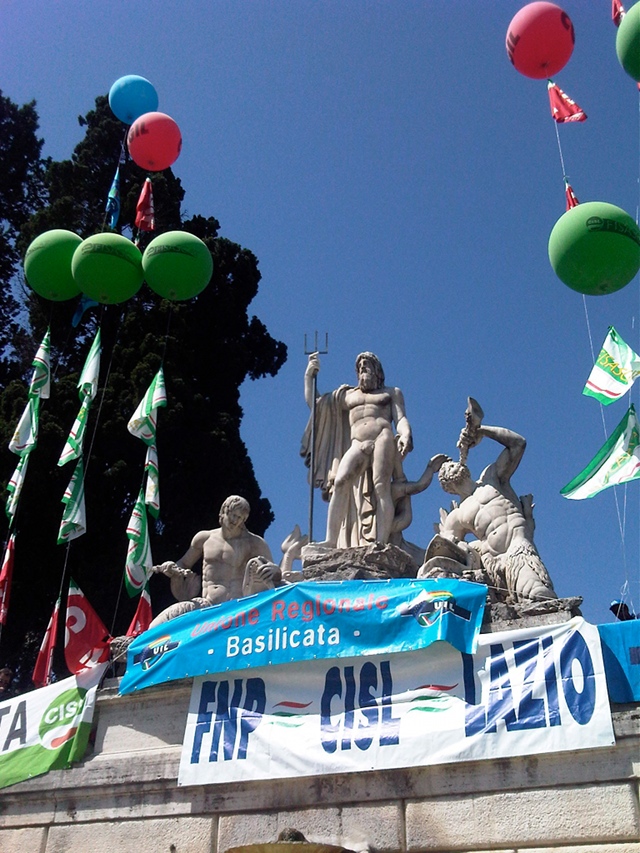 Neptune with his Trident stands watching for union demonstration at Rome's Piazza del Popolo