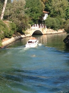 A boat glides down a canal on the Lido in Venice. August 26, 2013. Photo by Trisha Thomas