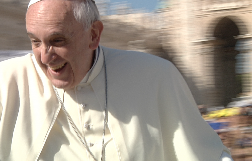 Pope Francis greets the crowd from his popemobile at his weekly audience. September 18, 2013. Freeze Frame of video shot by Gianfranco Stara.
