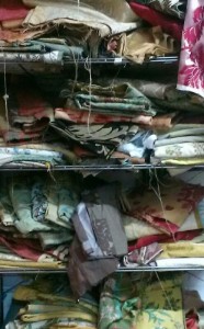 Pile of Damask Silk fabric on shelves in Rossana Petrillo's studio in Caserta, Italy. January 28, 2014. Photo by Trisha Thomas