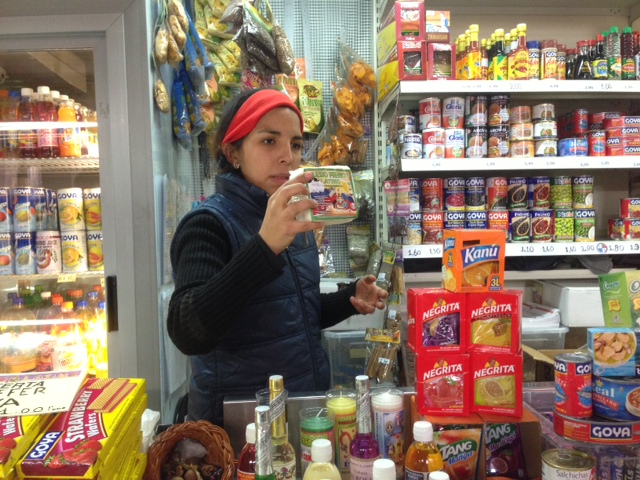 Diane from Ecuador selling products from South America at stand at Piazza Vittorio market in Rome. February 3, 2014. Photo by Trisha Thomas