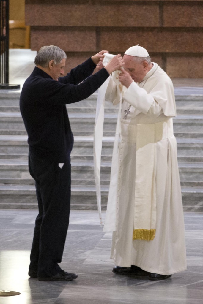 Don Luigi Ciotti places a stole belonging to assassinated priest Don Peppino Diana around the neck of Pope Francis. March 21, 2014. AP photographer Andrew Medichini for Mozzarella Mamma