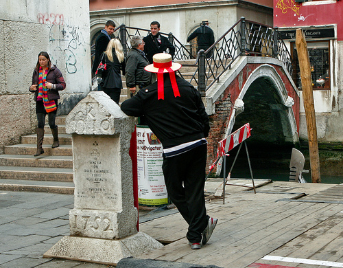 Drumming up business. A gondolier in Venice. Photo by Kay Gilmer