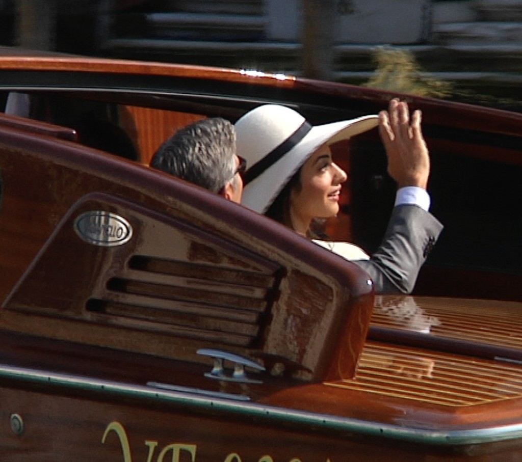 Amal Alamuddin and George Clooney on their way to their civil wedding ceremony in Venice. Freeze frame of video shot by Gianfranco Stara. September 30, 2014