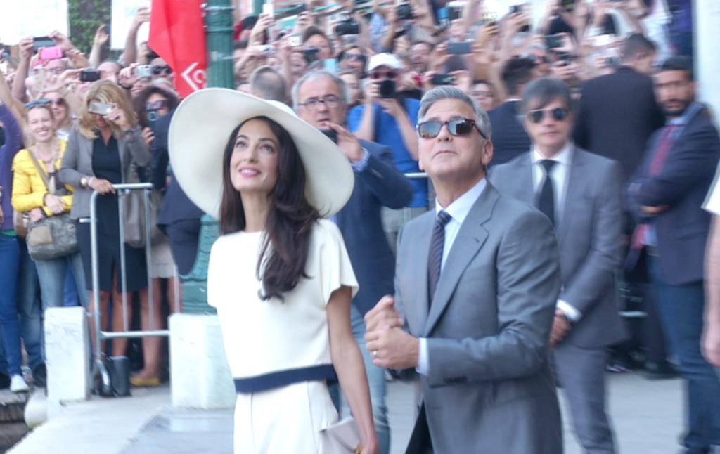 Amal Alamuddin and George looking up after leaving Palazzo Cavalli in Venice where they had their civil wedding ceremony. Freeze frame of video shot by APTN cameraman Pietro De Cristofaro. September 30, 2014
