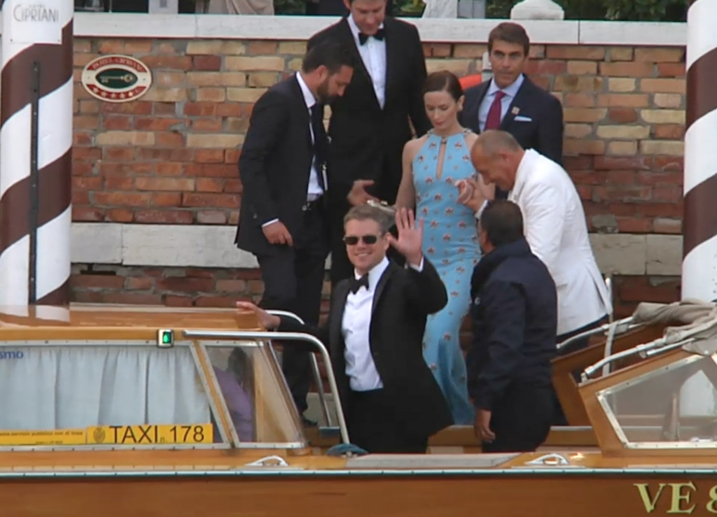 Matt Damon waves as he steps into water taxi going to George Clooney wedding. September 27, 2014. Freeze frame of video shot by AP Television cameraman Gianfranco Stara