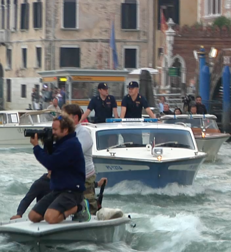 Paparazzi and police in Grand Canal following George Clooney's water taxi as he heads to his wedding ceremony. Freeze frame of video shot by AP Television cameraman Gianfranco Stara. September 27, 2014
