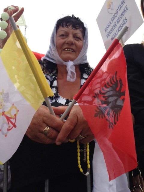 An Albanian woman waiting for Pope Francis to arrive at Mass in Tirana, Albania. Spetember 21, 2014 Photo by AP Television cameraman Gianfranco Stara