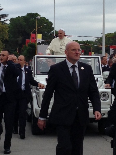 The head of the Pope's security, Domenico Giani, eyes the crowd carefully as the Popemobile makes its way through Piazza Mother Teresa in Tirana, Albania. September 21, 2014, Photo by Trisha Thomas