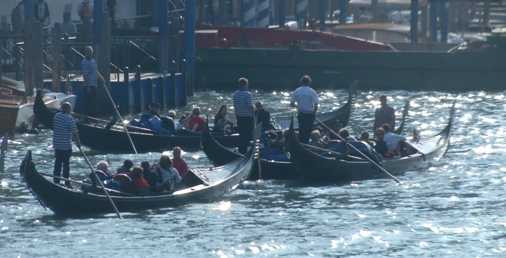 Gondolas on the Grand Canale in Venice. Freeze Frame of video shot by AP video-journalist Pietro De Cristofaro. September 25. 2014