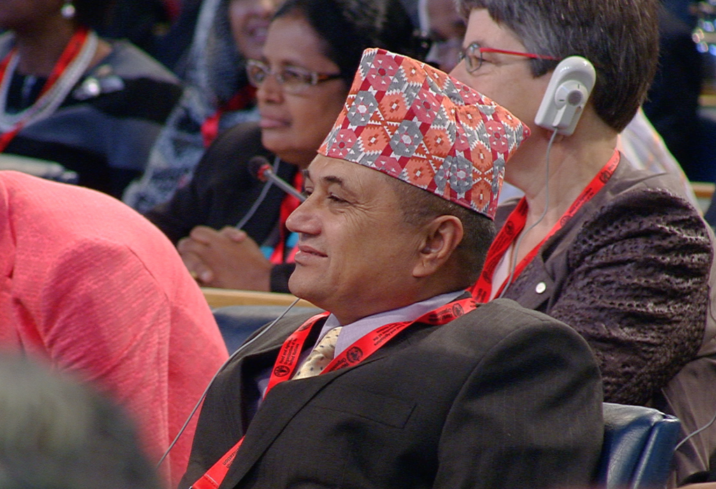 A delegate to the Second International Conference on Nutrition in Plenary Hall at the Food and Agriculture Organization in Rome. November 19, 2014. Freeze Frame of FAO Pool Video