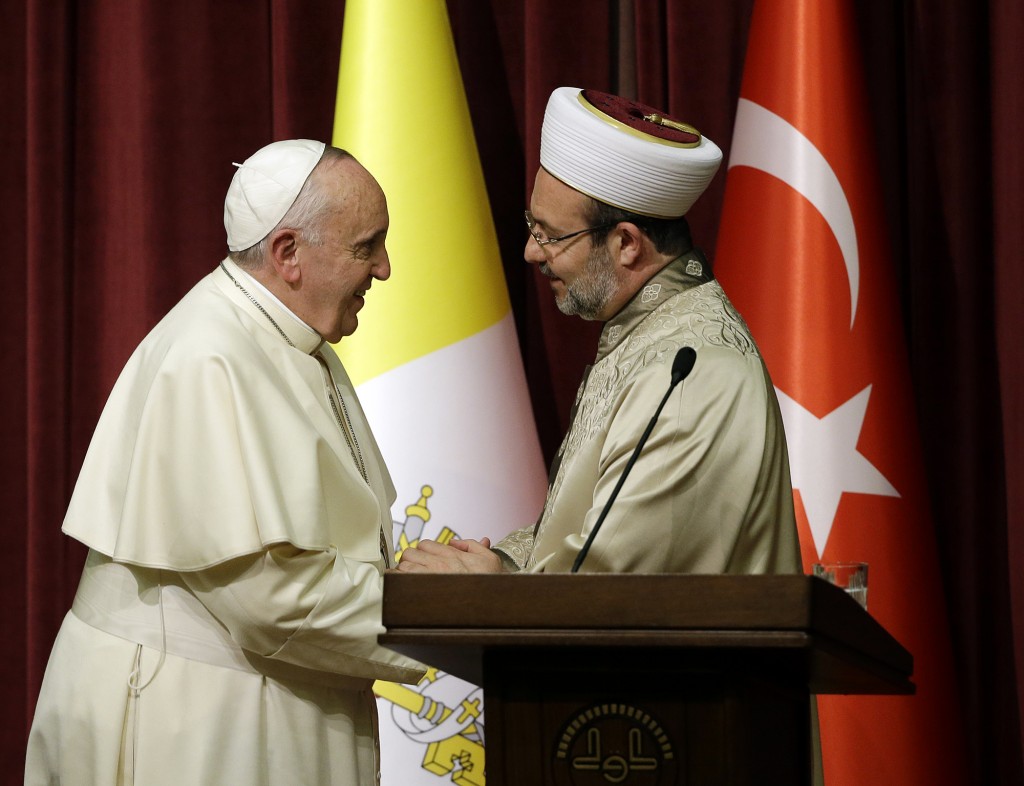 Pope Francis greets head of Turkey's Religious Affairs Mehmet Gormez, in Ankara, Friday, Nov. 28, 2014.  Photo for Mozzarella Mamma by   AP Photographer Gregorio Borgia