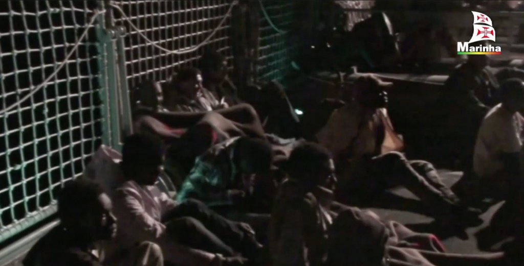 Freeze frame of videio of migrants on deck of Portuguese vessel the Viana Do Castelo. November 14, 2014. Credit: Portuguese Navy