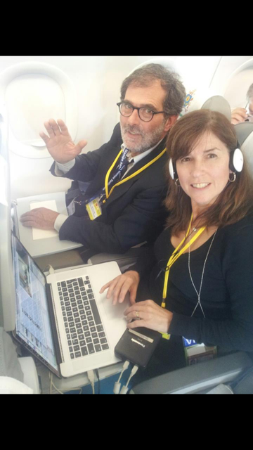 AP Cameraman Gianfranco Stara with Trisha Thomas editing a story on board Papal Plane.