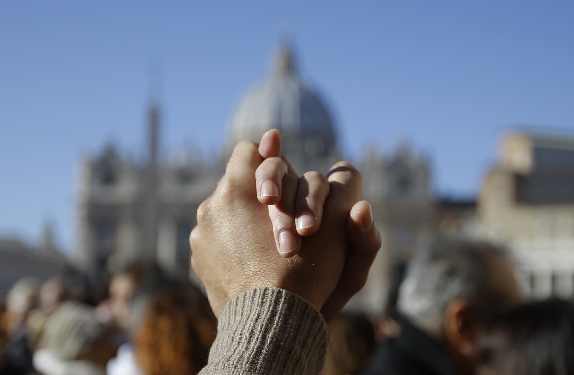The linked hands of a couple dancing the tango outside the Vatican for Pope Francis' 78th birthday. December 17, 2014. Photo by AP Photographer Gregorio Borgia for Mozzarella Mamma