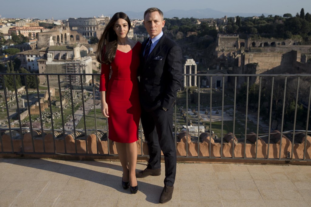 Actors Monica Bellucci and Daniel Craig pose for photographers on a terrace at Rome's City Hall with Roman Forum and Coliseum in background.  Photo by AP Photographer Andrew Medichini for Mozzarella Mamma. February 18, 2015