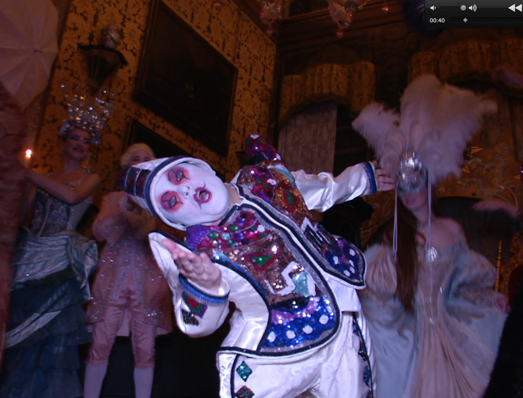 A dancing dwarf blows a kiss to the AP Television Camera at Il Ballo del Doge. February 7, 2015. Freeze frame of video shot by AP Television Cameraman Gigi Navarra.