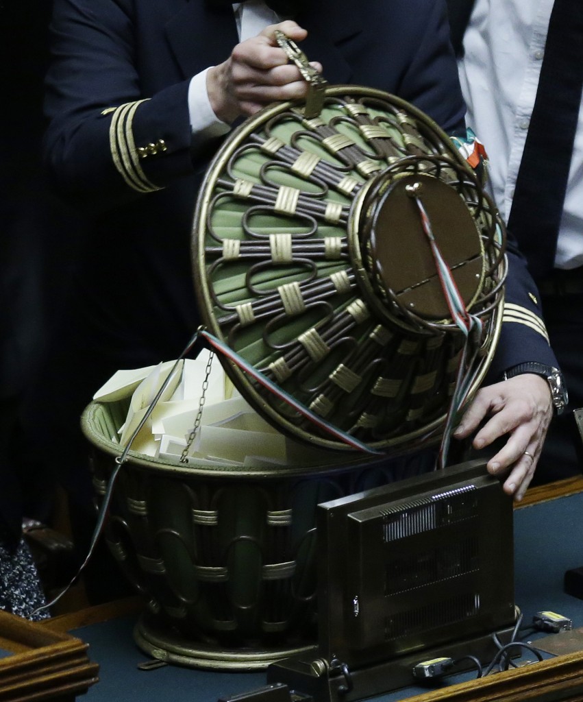 An Parliament Usher opens an basket-urn full of ballots in the Italian election for the President of the Republic.  Rome, January 30, 2015. Photo by AP Photographer Gregorio Borgia for Mozzarella Mamma