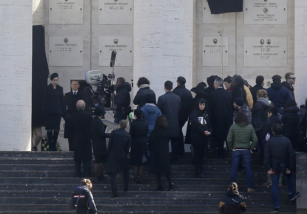 Actors Monica Bellucci and Daniel Craig (on left) taking part in a funeral scene on the set of the latest James Bond film "Spectre" on location in Rome. February 19, 2015. Photo for Mozzarella Mamma by AP photographer Gregorio Borgia