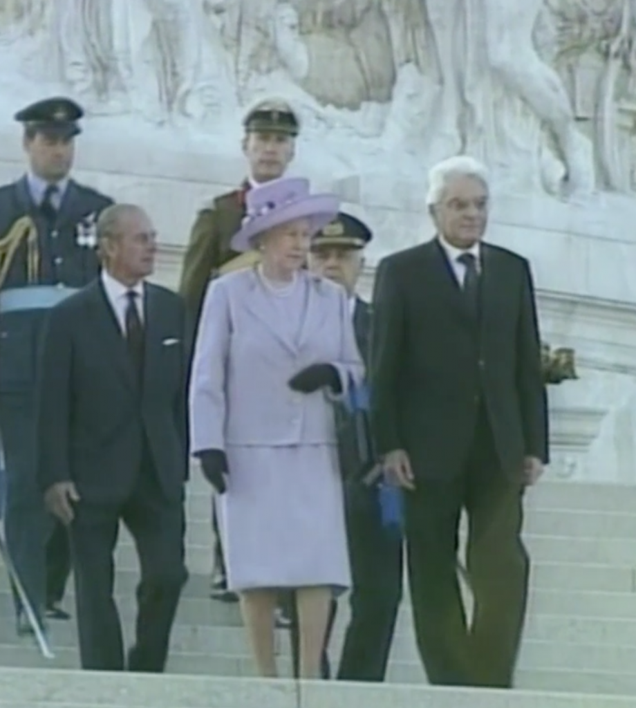 Then Defense Minister Sergio Mattarella with Queen Elizabeth II in Rome, 1999.  Freeze Frame of APTN video.