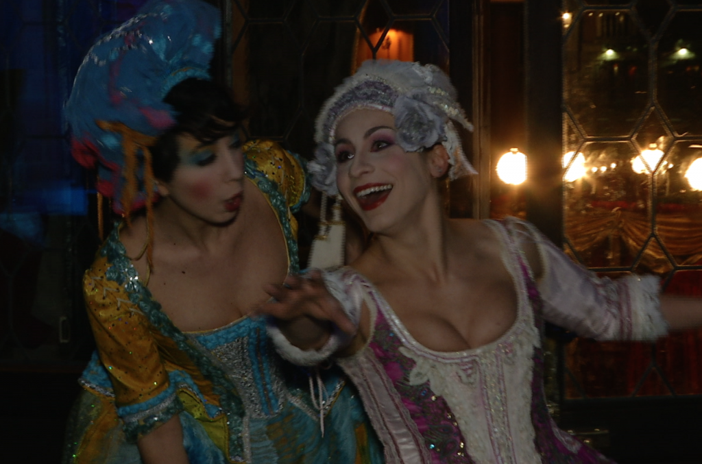 Performers from Commedia dell'Arte dressed as Smeraldina and Colombina, greet guests arriving at Il Ballo del Doge. February 7, 2015. Freeze frame of video shot by AP Television Cameraman Gigi Navarra. 