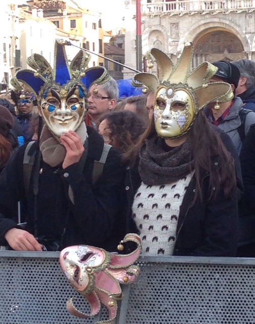 A young couple with masks in St. Mark's Square. February 7, 2015. Photo by Trisha Thomas