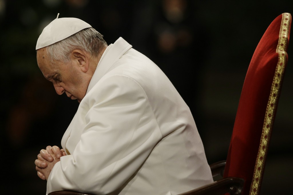 Pope Francis deep in prayer during the Via Crucis (Way of the Cross) ceremony at the Colosseum on Good Friday, April 3, 2015. Photo by AP Photographer Gregorio Borgia for Mozzarella Mamma