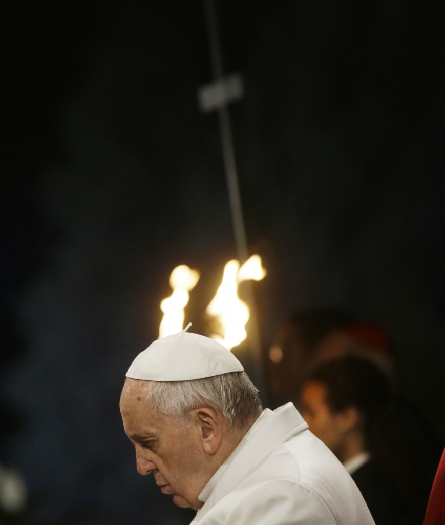 Pope Francis praying during the Via Crucis (Way of the Cross) ceremony at Rome's Colosseum on Good Friday. April 3, 2015. Photo by AP Photographer Gregorio Borgia for Mozzarella Mamma