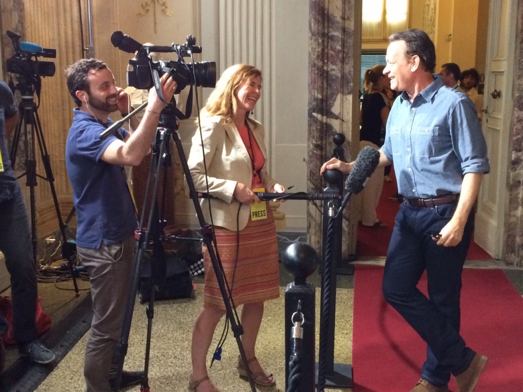 AP Television team Pietro De Cristofaro and Trisha Thomas getting a laugh as actor Tom Hanks describes filming of "Inferno".  Photo by Hanna Rantala from Reuters Television. Florence, May 11, 2015