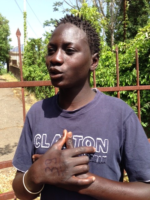 Baboucar Lowe, a 17-year-old migrant from Banjul, Gambia speaking to me and other AP colleagues in Nicolosi, Italy, May 6, 2015. Photo by Trisha Thomas
