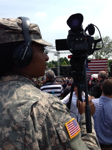 Combat camera specialist Gibson was in full fatigues and boots as she stood near me on the riser waiting for Michelle Obama to arrive. June 19, 2015. Photo by Trisha Thomas