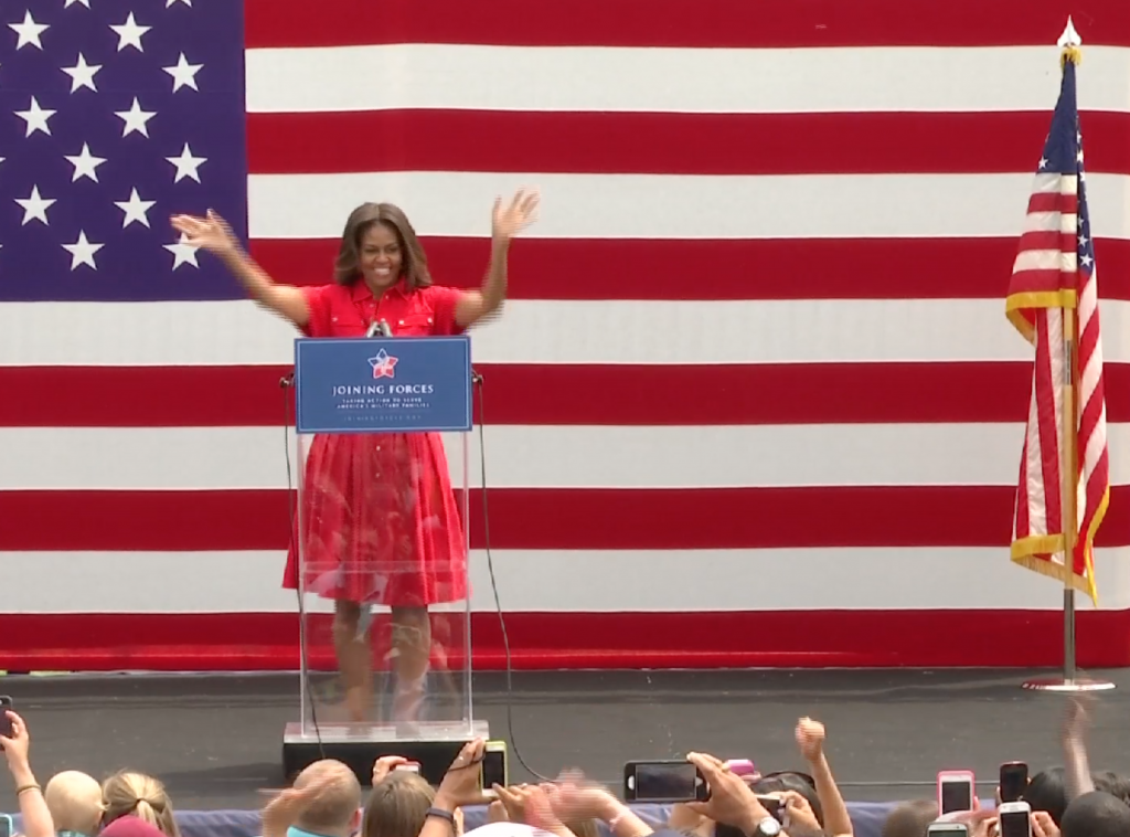 Michelle Obama greets the crowd at Vicenza Army Garrison in Northern Italy. June 19, 2015. Freeze frame of video shot by AP Television Cameraman Gigi Navarra