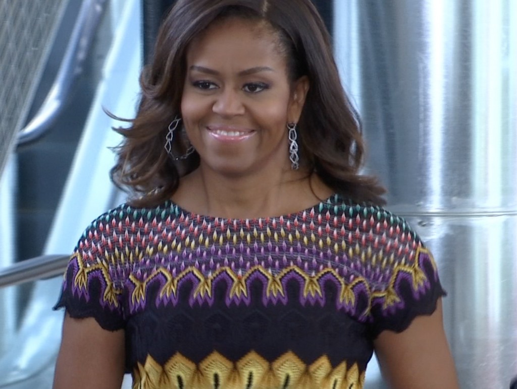 First Lady Michelle Obama jogs into event at Milan Expo 2015. June 18, 2015. Freeze frame of video shot by AP Television Cameraman Gigi Navarra