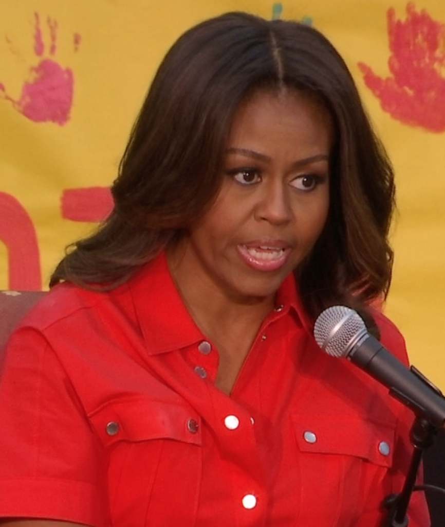 Michelle Obama telling kids to read at US Army Garrison in Vicenza, Italy. Freeze frame of video shot by AP cameraman Gigi Navarra. June 19, 2015