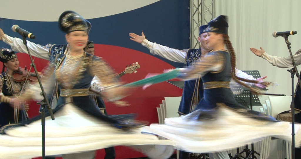 Russian Dancers performing outside the Russia Pavilion at Milan EXPO 2015. June 10, 2015.  Freeze frame of video shot for AP Television by Brian Hendrie