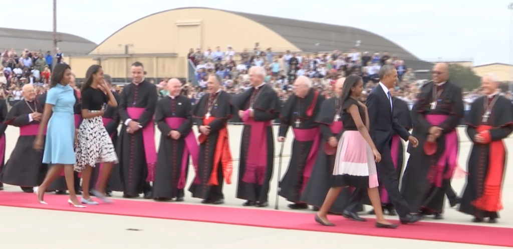 Obama family heads down red carpet to meet Pope Francis as gets off plane. Freeze frame of video shot by AP Television video-journalist Paolo Santalucia. September 22, 2015