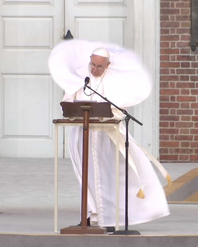 Pope Francis looks a bit like a flying saucer as he speaks in front of Independence Hall in Philadelphia and a gust of wind blows his vestments about. He is using the lectern used by Abraham Lincoln for the Gettysburg Address. Freeze frame of video shot by video-journalist Paolo Santalucia for AP Television, September 26, 2015
