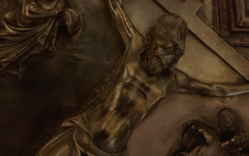 Close up of work in progress on "The Crucifixion" panel on the replica of Ghiberti's North Doors.  Freeze frame of video shot by AP cameraman Gigi Navarra. Florence, November 20, 2015
