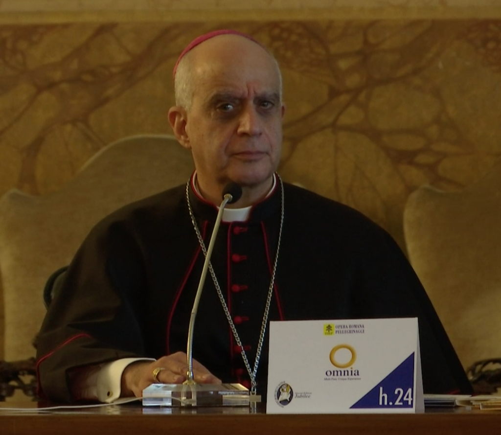 Archbishop Rino Fisichella gets irritated over question on indulgence at a press conference in Rome. December 3, 2015.  Freeze frame of video shot for AP Television by AP VJ Paolo Santalucia