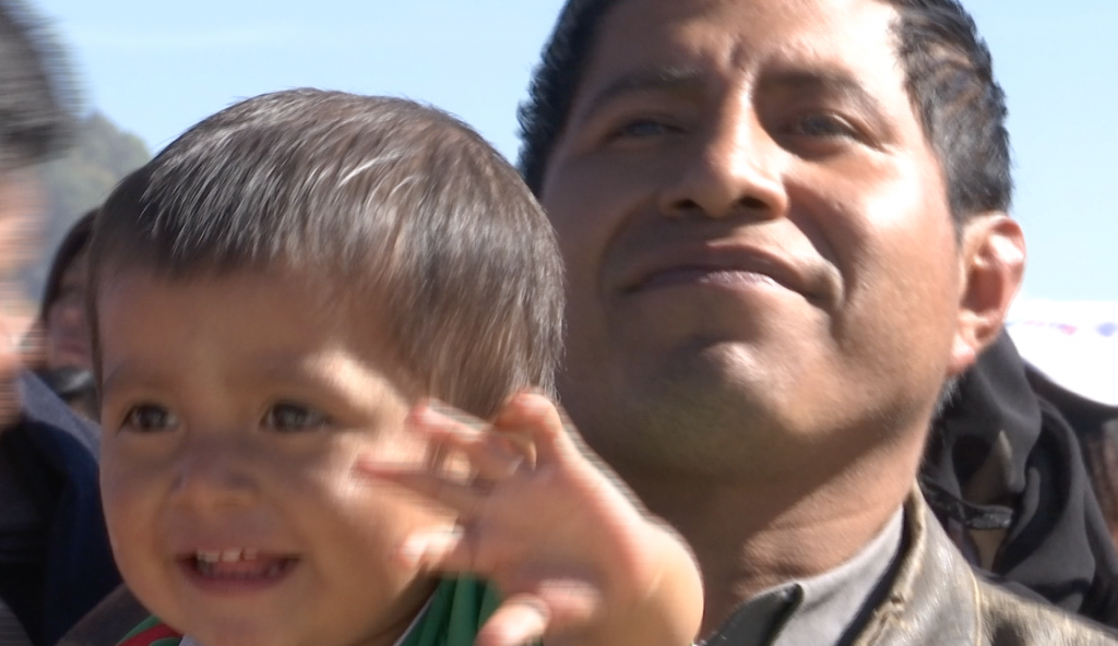 Little boy waves as Pope's helicopter arrives in San Cristobal de Las Casas in Chiapas, Mexico. February 15, 2016. Freeze frame of video shot by AP Television VJ Paolo Santalucia.