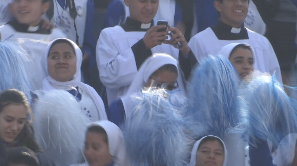 Nuns looking like cheerleaders with pom-poms sing, dance and cheer while waiting for Pope Francis in Morelia. February 16, 2016. Freeze frame of video shot by AP Television VJ Paolo Santalucia.