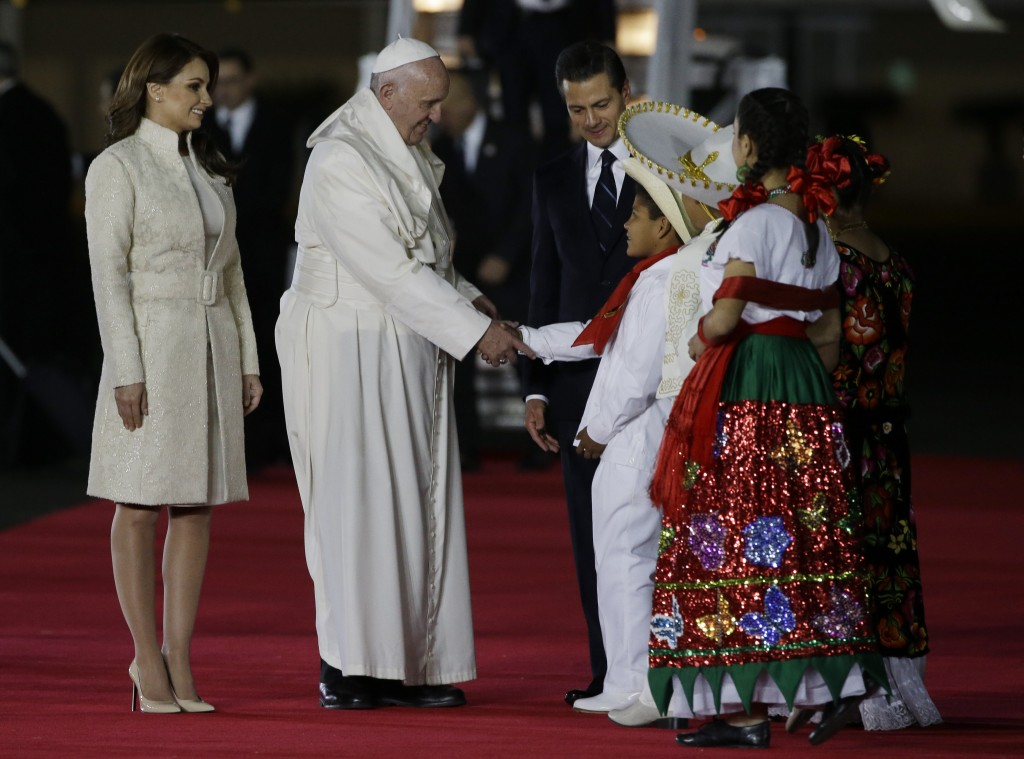 Pope Francis is welcomed by Mexico's President Enrique Pena Nieto and his wife Angelica Rivera upon his arrival in Mexico City, Friday, Feb. 12, 2016. Photo by AP Photographer Gregorio Borgia (for Mozzarella Mamma)