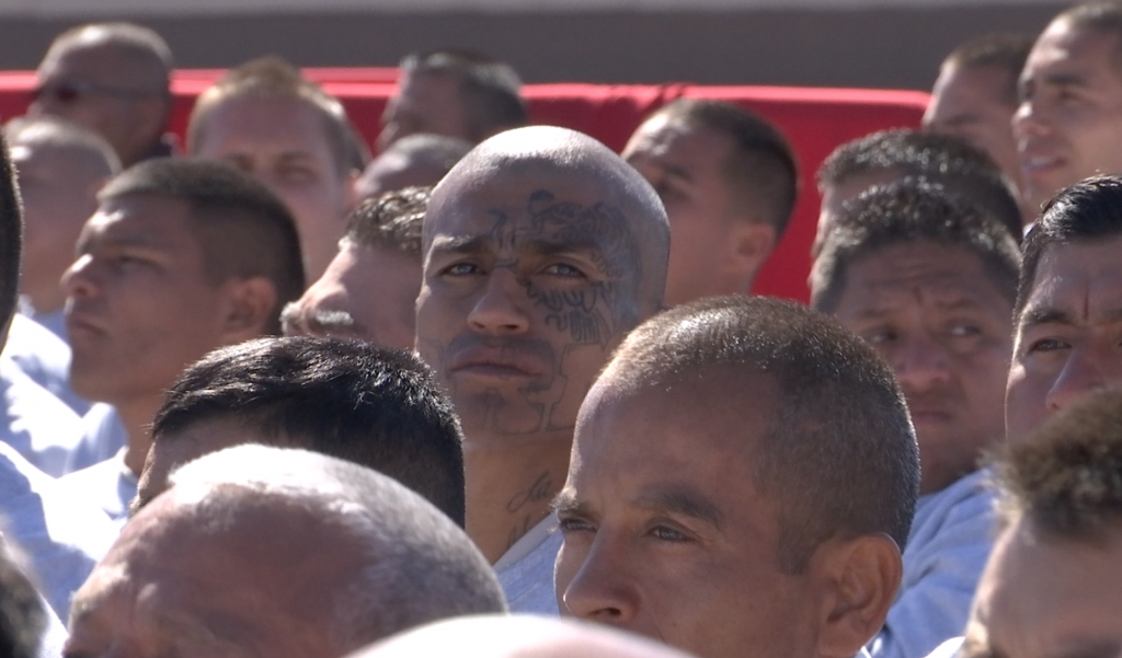 Prisoner with tattoo on his face in group listening to Pope Francis at Cereso N. 3 Prison in Juarez. Freeze frame shot by AP Television VJ Paolo Santalucia. February 17, 2016