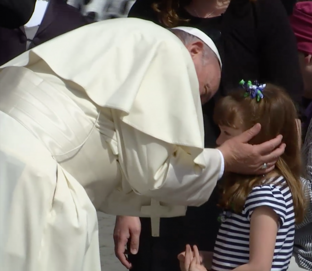Pope Francis greets Ohio girl Lizzy Myers at the end of his weekly audience. April 6, 2016. Freeze frame of video shot by AP Television cameraman Gianfranco Stara