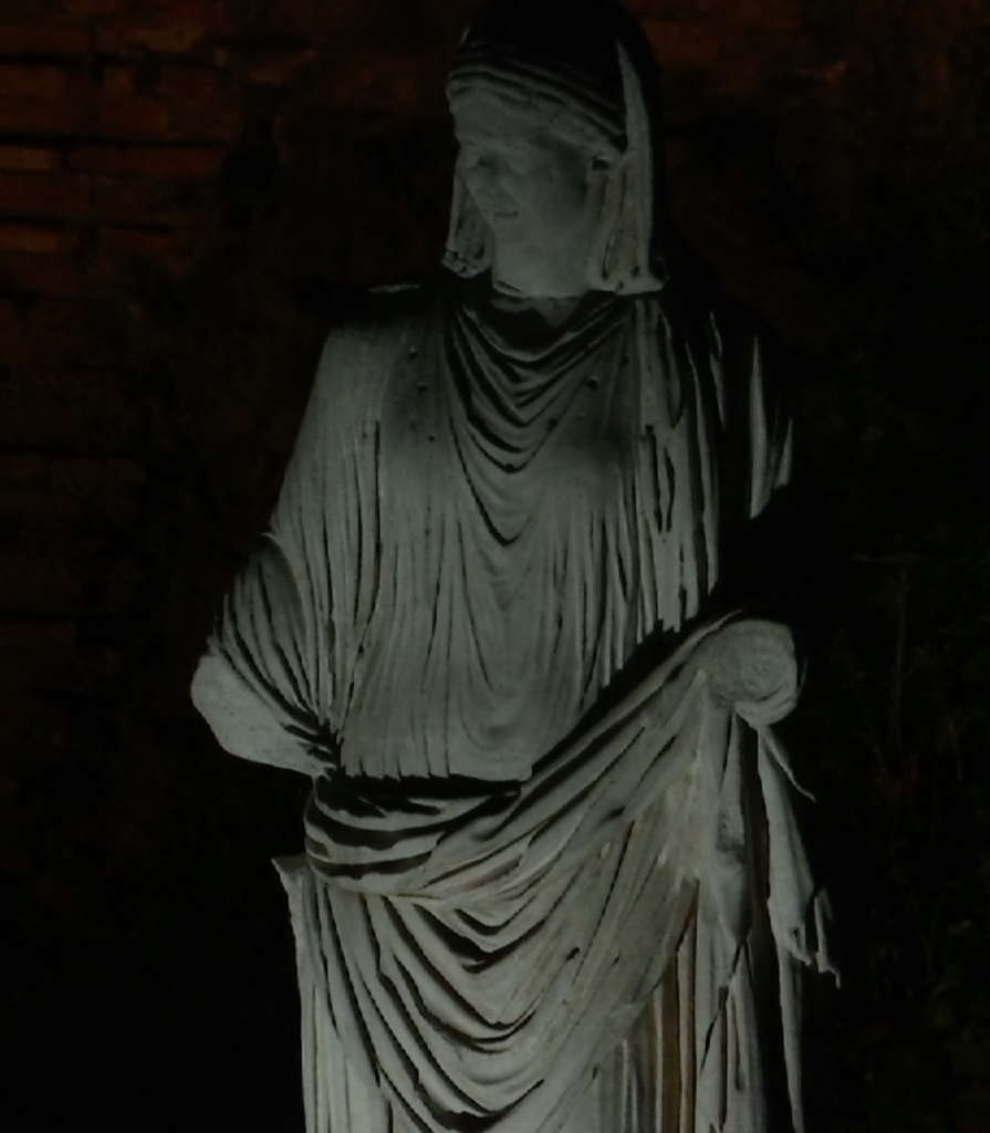 Statue of a vestal virgin lit up at night in the Roman Forum. Freeze frame of video shot by AP Television Cameraman Gigi Navarra. April 19, 2016