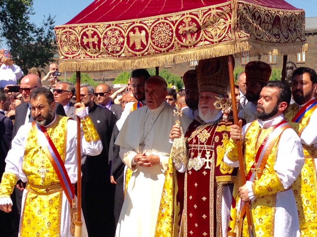 Pope Francis walking under a canopy with Armenian Apostolic Patriarch Catholicos Karekin II at Etchmiadzin. June 26, 2016. Photo by Trisha Thomas
