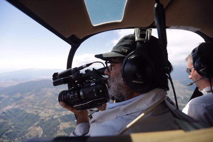 AP Television Cameraman Gianfranco Stara films the earthquake destroyed town of Amatrice from a helicopter. Photo by AP photographer Gregorio Borgia. August 24, 2016