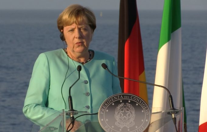 Angela Merkel speaking to reporters aboard the aircraft carrier Garibaldi. Freeze frame of video shot by AP Television cameraman Gianfranco Stara. August 22, 2016
