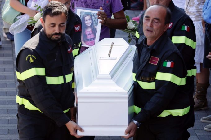 Firefighters carry coffin of 9-year-old Giulia Rinaldo following state funeral in Ascoli Piceno. Photo by AP photographer Gregorio Borgia, August 27, 2016