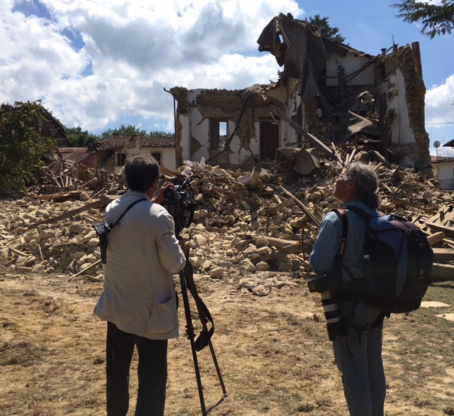 AP team of cameraman Gianfranco Stara and photographer Gregorio Borgia shooting destroyed home of British family in Sommati. Photo by Trisha Thomas, August 26, 2016